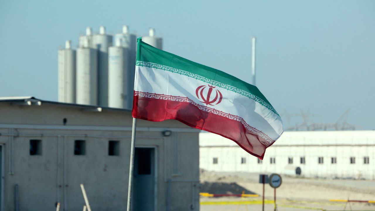 A picture taken on November 10, 2019, shows an Iranian flag in Iran's Bushehr nuclear power plant, during an official ceremony to kick-start works on a second reactor at the facility. - Bushehr is Iran's only nuclear power station and is currently running on imported fuel from Russia that is closely monitored by the UN's International Atomic Energy Agency. (Photo by ATTA KENARE / AFP)