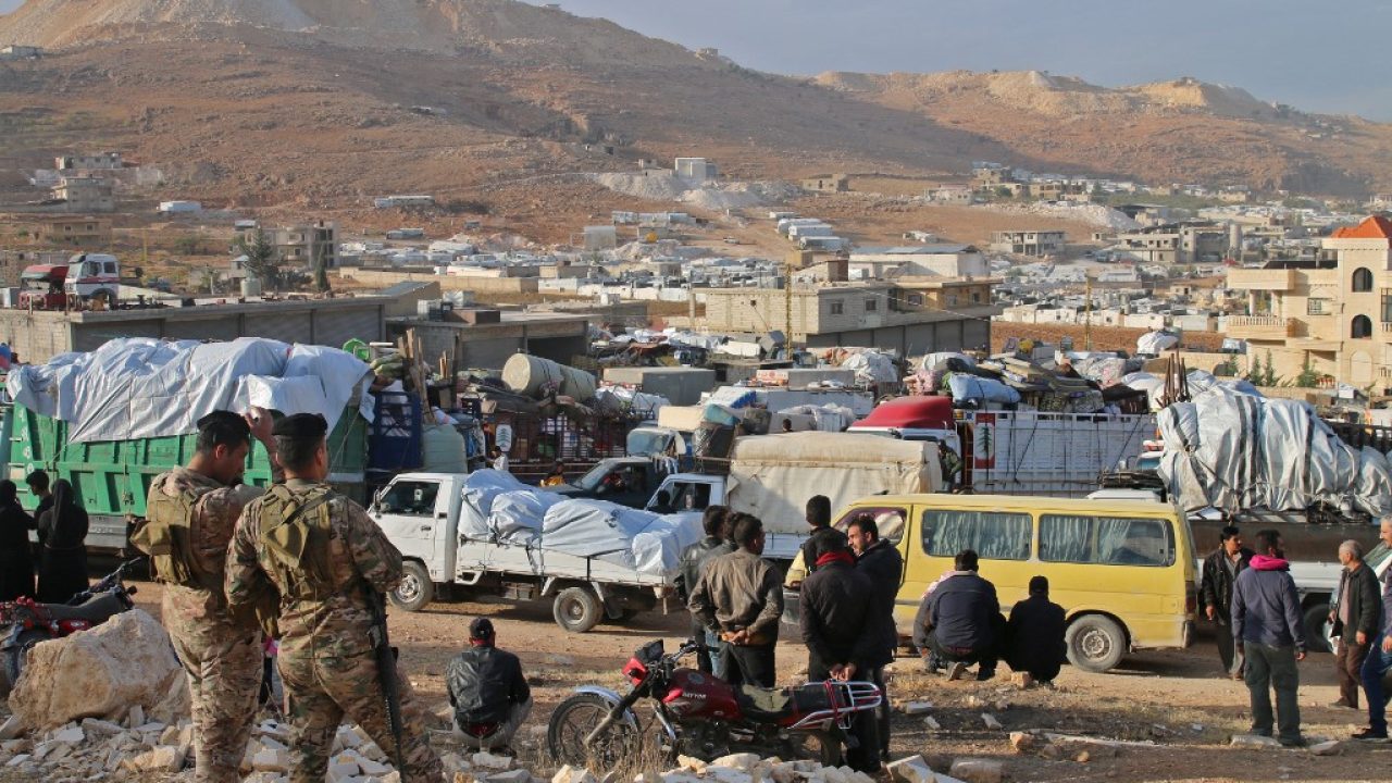 Syrians refugees prepare to leave Lebanon towards Syrian territory through the Wadi Hamid crossing in Arsal on October 26, 2022. A first batch of Syrian refugees left Lebanon today for their home country, an AFP photographer said, the first step in a new repatriation plan slammed by rights groups. (Photo by AFP)