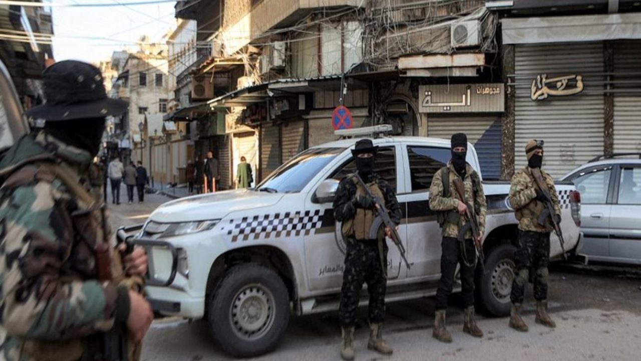 Security forces deploy outside the Greek Orthodox Cathedral of St George during the Christmas morning mass in Syria's western coastal city of Latakia on December 25, 2024. (Photo by AAREF WATAD / AFP)