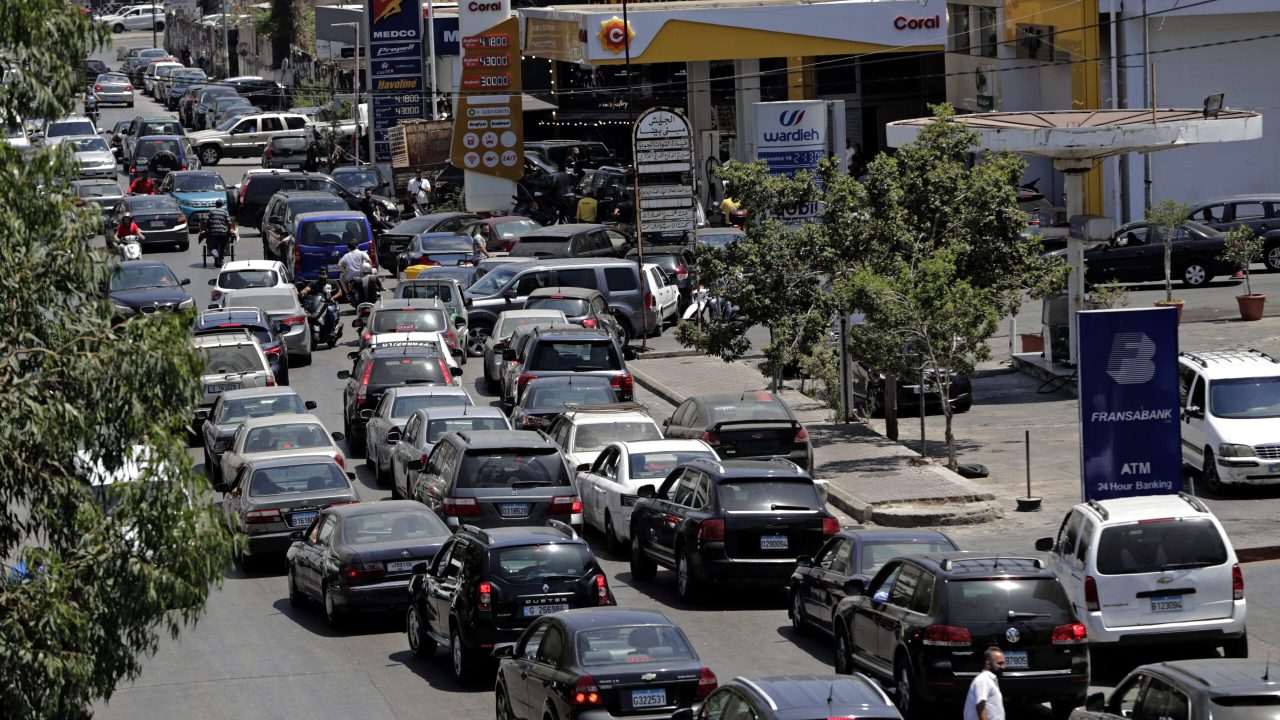 Vehicles queue-up for fuel at a petrol station in Lebanon's capital Beirut on June 11, 2021, amidst severe fuel shortages. - The head of Lebanon's powerful Shiite movement Hezbollah on June 8 said that the country could soon be forced to rely on fuel imports from Iran, amid an ongoing economic collapse. Lebanon has been facing a fuel crisis in recent months, with long queues at service stations and some drivers waiting more than an hour to buy even small quantities of supplies. (Photo by ANWAR AMRO / AFP)