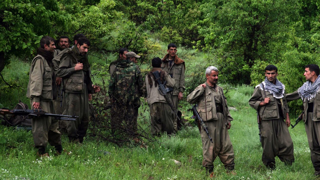 Kurdistan Workers' Party (PKK) fighters greet their comrades as they arrive in the northern Iraqi city of Dohuk on May 14, 2013, after leaving Turkey as part of a peace drive with Ankara. The PKK has fought a 29-year nationalist campaign against Ankara in which some 45,000 people have died, but is now withdrawing its fighters from Turkey as part of a push for peace with the Turkish authorities. AFP PHOTO/SAFIN HAMED (Photo by SAFIN HAMED / AFP)