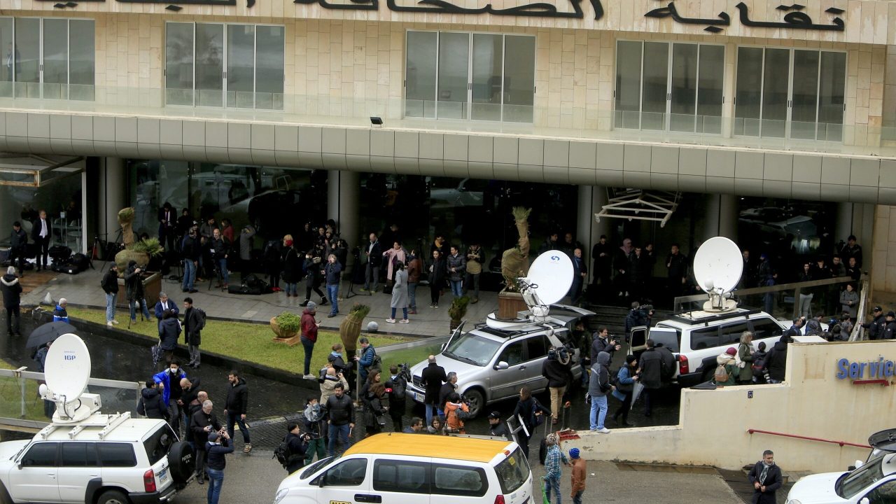 Journalists gather outside the building of Lebanese Press Syndicate where former Nissan chairman Carlos Ghosn is expected to hold a news conference in Beirut, Lebanon January 8, 2020. REUTERS/Ali Hashisho - RC2NBE9FM2V4