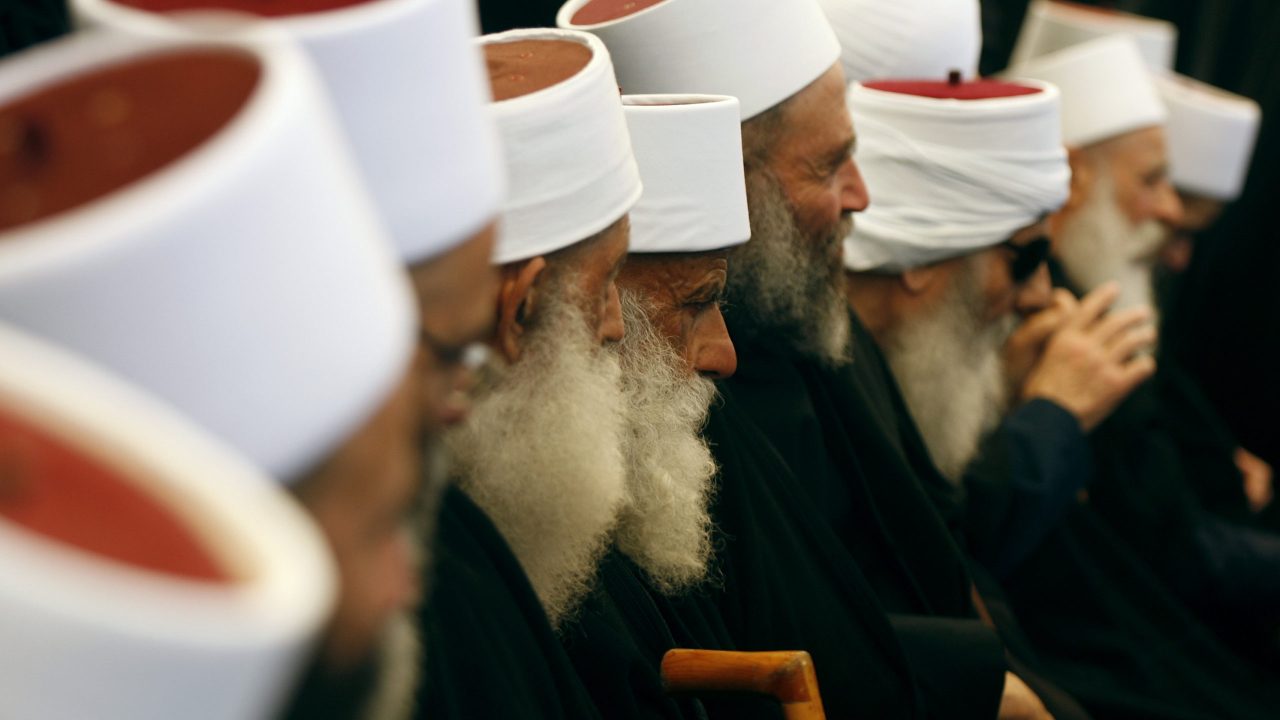 LEBANON-FUNERAL-DRUZE-WALIEDDINE Lebanese Druze men mourn the death of Sheikh Abu Mohammad Jawad Walieddine, the head of the spiritual Druze council, during his funeral in the village of Baaqlin, south of Beirut, on April 28 2012. AFP PHOTO / STR
