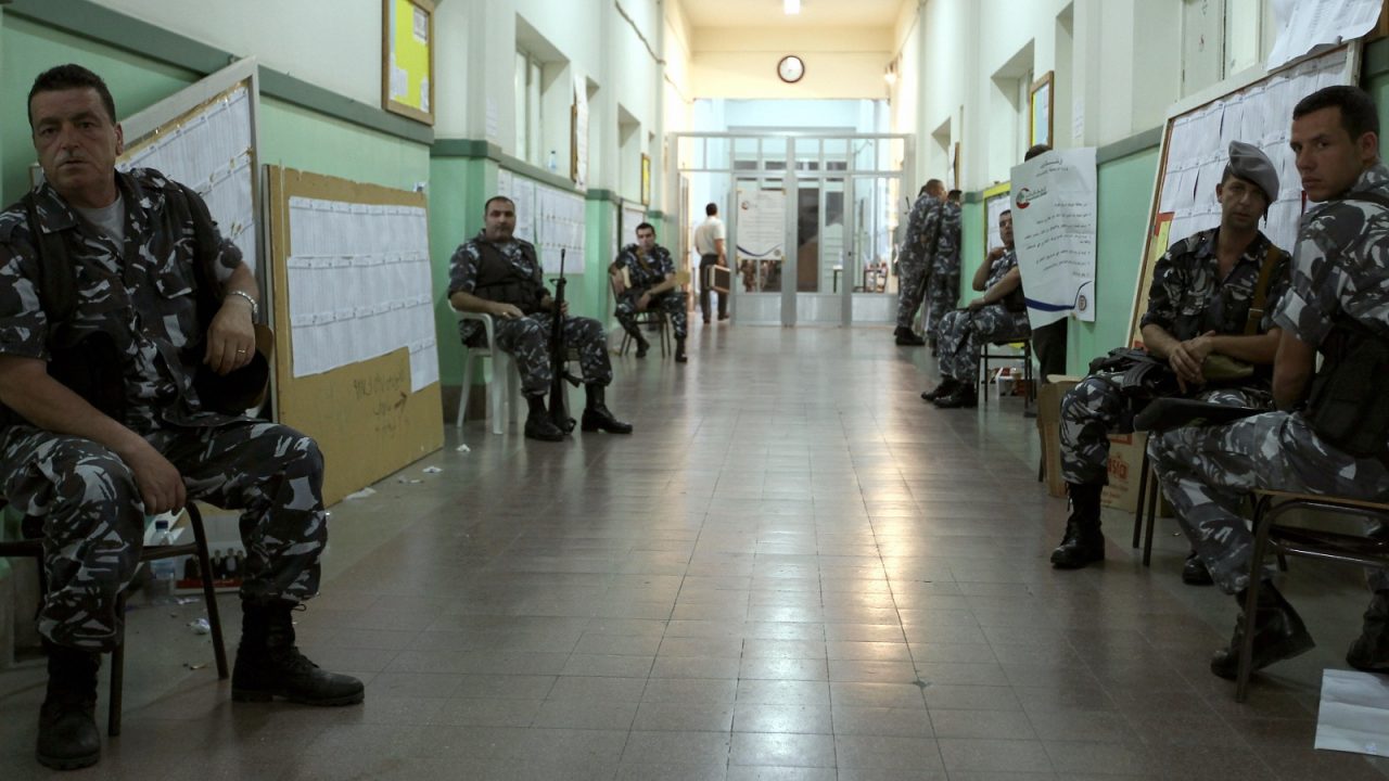 Members of the Lebanese Interior Security Forces guard closed polling stations as votes are counted in Beirut's Christian stronghold of Ashrafieh on June 7, 2009. Polling officially ended in Lebanon's hotly contested general election which pitted the Western-backed majority in parliament against an alliance led by Iranian-backed Hezbollah. AFP PHOTO/PATRICK BAZ (Photo credit should read PATRICK BAZ/AFP via Getty Images)