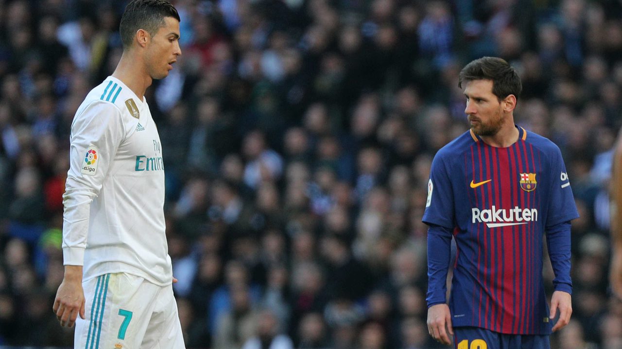 Soccer Football - La Liga Santander - Real Madrid vs FC Barcelona - Santiago Bernabeu, Madrid, Spain - December 23, 2017   Barcelona’s Lionel Messi alongside Real Madrid’s Cristiano Ronaldo    REUTERS/Sergio Perez