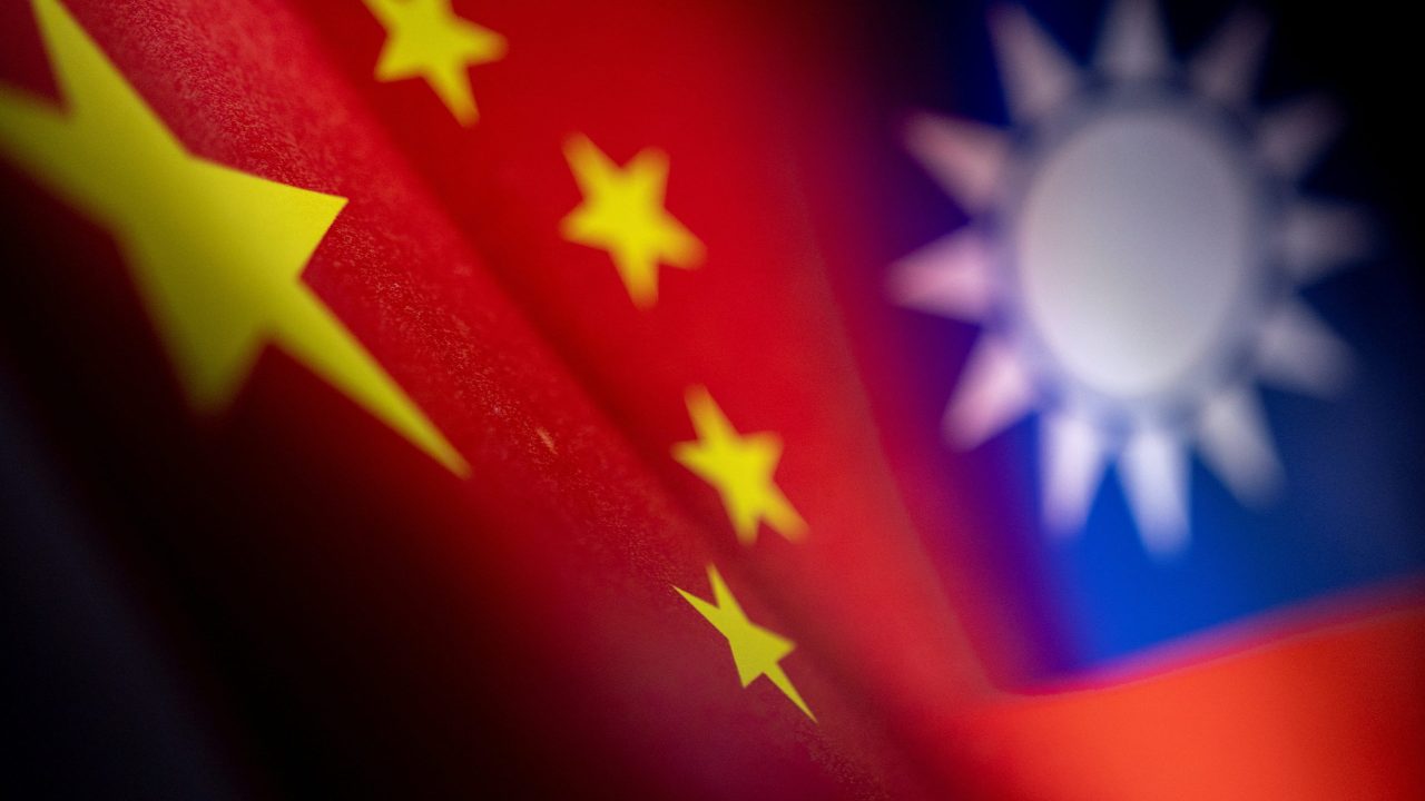 Chinese and Taiwanese printed flags are seen in this illustration taken, April 28, 2022. Picture taken April 28, 2022.  REUTERS/Dado Ruvic/Illustration