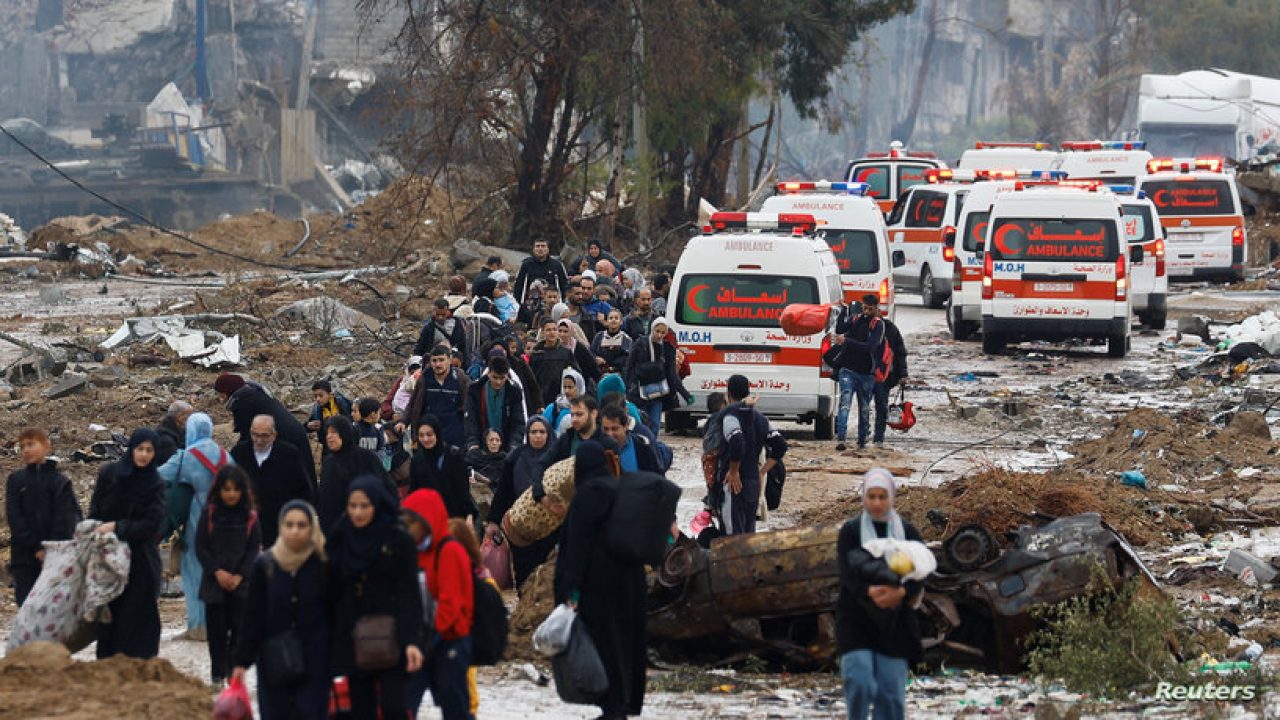Palestinians fleeing north Gaza move southward as ambulances head towards north Gaza during a temporary truce between Israel and Hamas, near Gaza City, November 27, 2023. REUTERS/Ibraheem Abu Mustafa