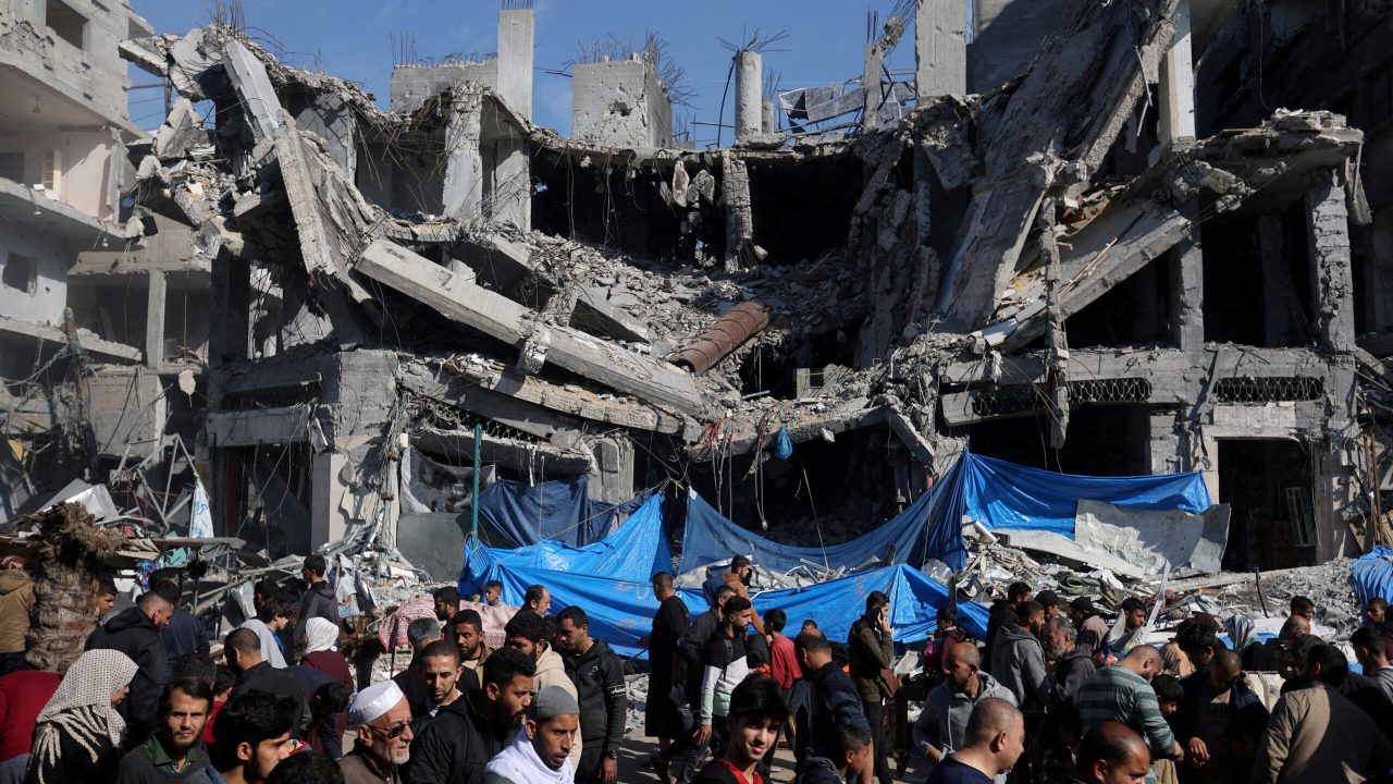 FILE PHOTO: Palestinians shop near the ruins of houses and buildings destroyed in Israeli strikes during the conflict FILE PHOTO: Palestinians shop in an open-air market near the ruins of houses and buildings destroyed in Israeli strikes during the conflict, amid a temporary truce between Hamas and Israel, in Nuseirat refugee camp in the central Gaza Strip November 30, 2023. REUTERS/Ibraheem Abu Mustafa/File Photo
