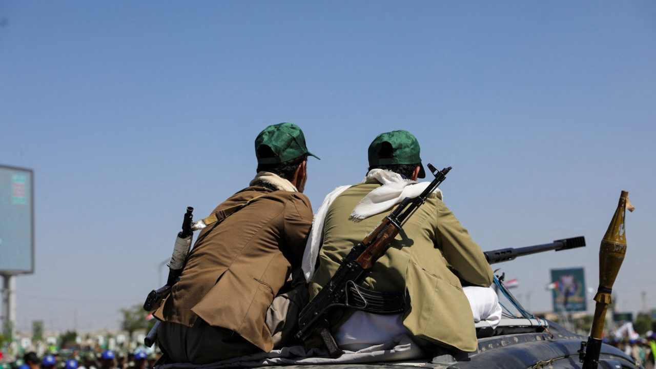 Houthi-mobilized fighters ride atop a car during a ceremony marking the 10th anniversary of the Houthi takeover in Sanaa, Yemen September 21, 2024. REUTERS/Khaled Abdullah