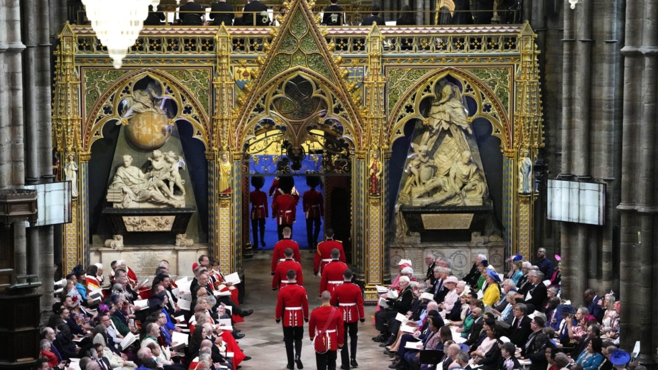 BRITAIN-ROYALS-CORONATION Service personnel from Regiments of the Household Division holding the Freedom of the City of London, who will hold the Anointing Screen, arrive inside Westminster Abbey in central London on May 6, 2023, ahead of the coronations of Britain's King Charles III and Britain's Camilla, Queen Consort. - The set-piece coronation is the first in Britain in 70 years, and only the second in history to be televised. Charles will be the 40th reigning monarch to be crowned at the central London church since King William I in 1066. Outside the UK, he is also king of 14 other Commonwealth countries, including Australia, Canada and New Zealand. Camilla, his second wife, will be crowned queen alongside him, and be known as Queen Camilla after the ceremony. (Photo by Kirsty Wigglesworth / POOL / AFP)