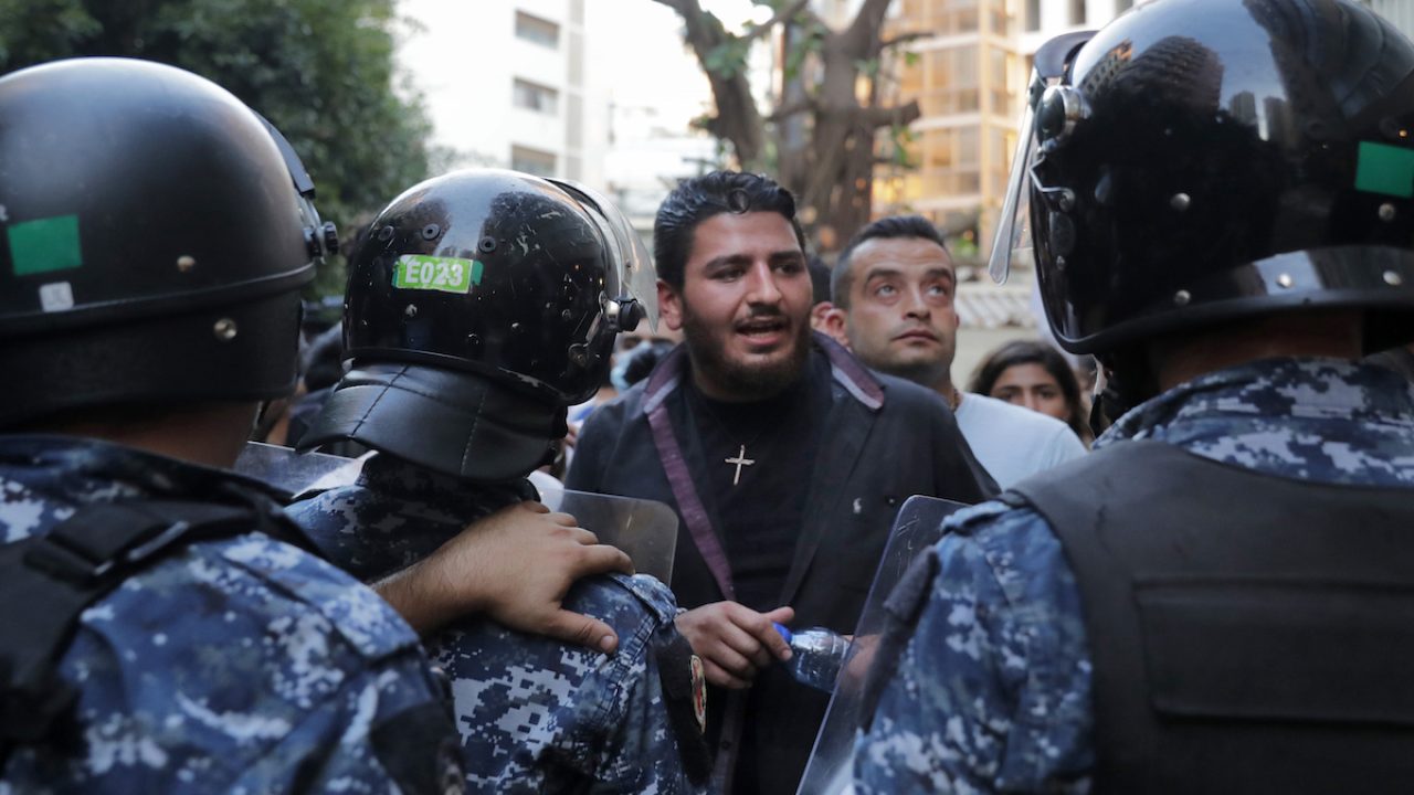 LEBANON-EXPLOSION-JUSTICE-ARREST This file photo take on July 13, 2021 shows Lebanese activist William Noun (C), whose brother was killed in the massive port explosion in Beirut in August 2020, during a demonstration outside the residence of the minister of interior in the Lebanese capital against the authorities' lack of action to achieve justice for the victims of the bombing. - Noun -- whose brother, a fireman, was killed in the August 2020 Beirut port blast -- was arrested on January 13, 2023 over remarks made during a television programme, a judiciary source told AFP. The young man is a leading figure among families of the blast's victims who have been calling for the continuation of a probe into the tragic event, on hold for over a year. (Photo by ANWAR AMRO / AFP)