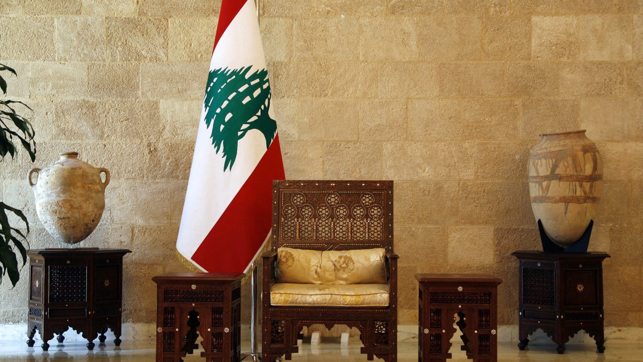 The Lebanese presidential seat is seen in front of a national flag at the "Salle des Ambassadeurs" (Room of the ambassadors) at the presidential palace in Baabda on May 22, 2008. Lebanon's parliament speaker Nabih Berri has formally summoned lawmakers to elect army chief Michel Sleiman president on May 25, his office announced today. AFP PHOTO/PATRICK BAZ