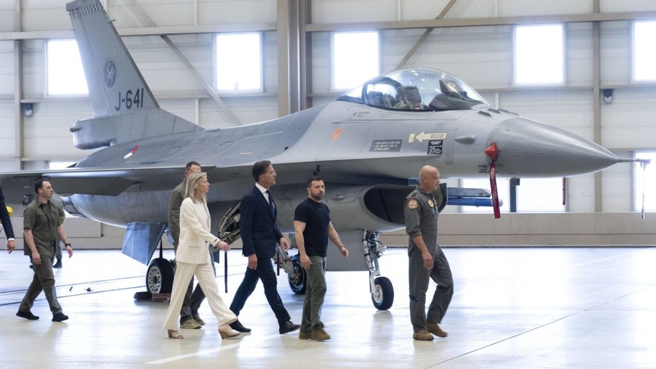 FILE - Ukrainian President Volodymyr Zelenskyy, second right, and Dutch caretaker Prime Minister Mark Rutte, center, look at F-16 fighter jets in Eindhoven, Netherlands, on Aug. 20, 2023. The Dutch government announced Friday Dec. 22, 2023 it is preparing to give 18 F-16 fighter jets to Ukraine, in a boost for the embattled nation that is growing increasingly anxious about aid from its Western allies. (AP Photo/Peter Dejong)