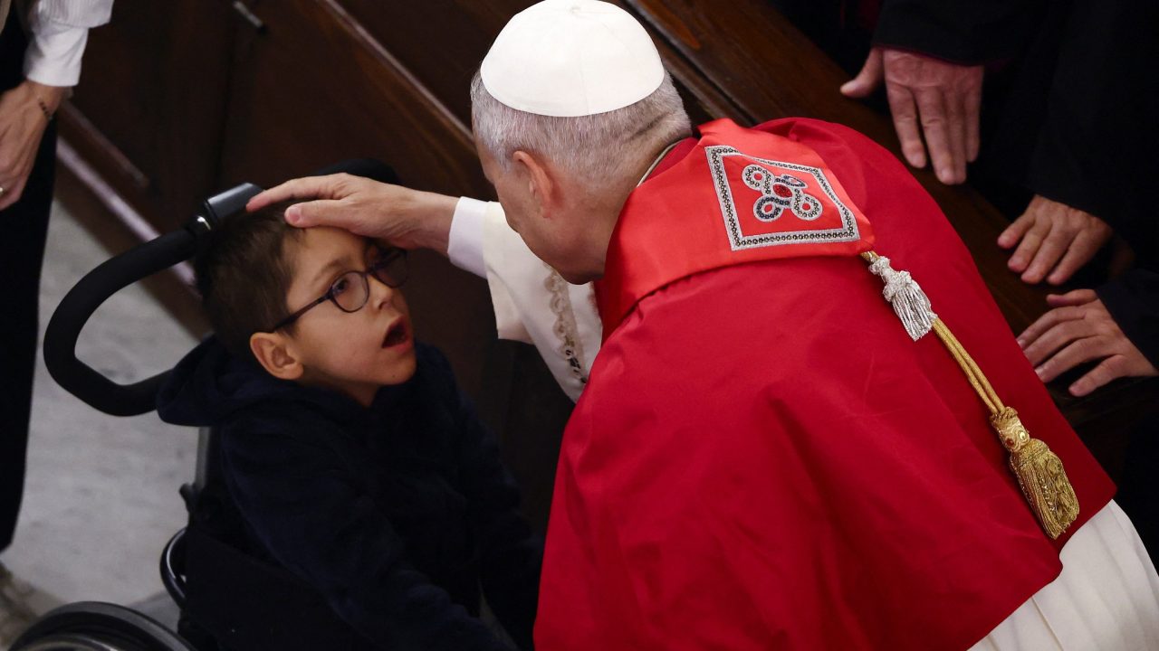 Pope Leo XIV blesses a child in a wheelchair during a meeting with bishops, priests, deacons, consecrated persons, seminarians and pastoral workers at the Catholic Cathedral of the Holy Spirit, known as the St. Esprit Cathedral, during his first apostolic journey, in Istanbul, Turkey, November 28, 2025. REUTERS/Yara Nardi
