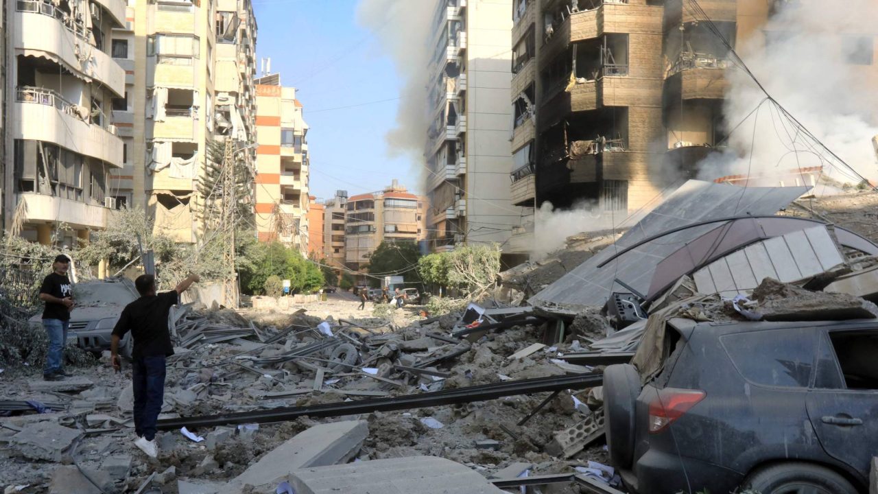 People inspect on September 28, 2024 the devastation in the Hadath district of Beirut's southern suburbs in the aftermath of intense overnight Israeli airstrikes that targeted the outskirts of the Lebanese capital. Israeli fighter jets bombarded the southern suburbs of Beirut overnight into September 28, sending panicked families fleeing massive strikes that were reportedly targeting Hezbollah chief Hassan Nasrallah. (Photo by AFP)