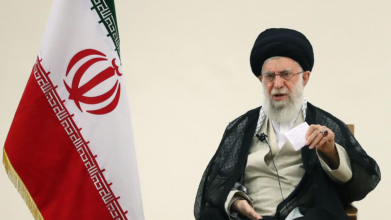 A handout picture provided by the office of Iran's Supreme Leader Ayatollah Ali Khamenei on August 11, 2021, shows him (L) during talks with Iraian TV about of Corona Situation in the capital Tehran.