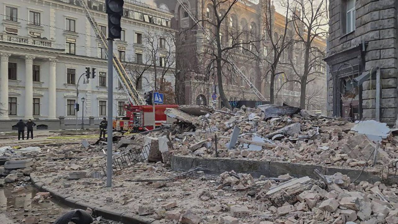 A view of debris on a street from nearby buildings, hundreds of meters from Ukraine's Presidential Office after a Russian drone attack in Kyiv, Ukraine, Wednesday, Jan. 1 2025. (AP Photo/Oksana Johannesson)