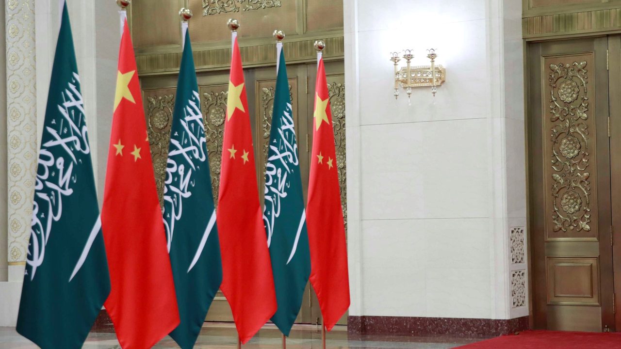 A Chinese security officer yawns as he stands guard at the door where Saudi Crown Prince Mohammad bin Salman and Chinese President Xi Jinping hold their meeting at the Great Hall of the People in Beijing, Friday, Feb. 22, 2019. Prince Mohammad is in China as part of a tour of Asian countries. (How Hwee Young/Pool Photo via AP)