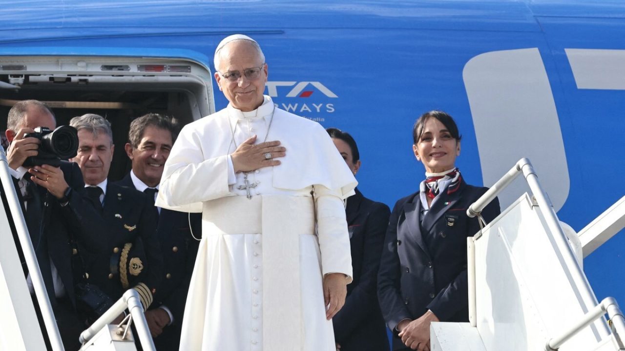 Pope Leo XIV gestures upon departing Beirut International Airport on December 2, 2025. Pope Leo appealed on December 2 for an end to "attacks and hostilities" as he prepared to depart Lebanon, which has been hit by frequent Israeli strikes despite a yearlong ceasefire with militant group Hezbollah. (Photo by IBRAHIM AMRO / AFP)