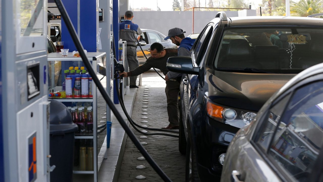 Syrians queue to fill their car with gasoline at a station in the capital Damascus on April 8, 2019. - The lines at the stations were the latest sign of a fuel crisis hitting regime-held parts of war-torn Syria, as the government set a cap on the daily consumption of subsidised petrol. Syria's government has been facing a flurry of international sanctions since the conflict started in 2011, including over the import of petroleum-related products. (Photo by LOUAI BESHARA / AFP)        (Photo credit should read LOUAI BESHARA/AFP/Getty Images)