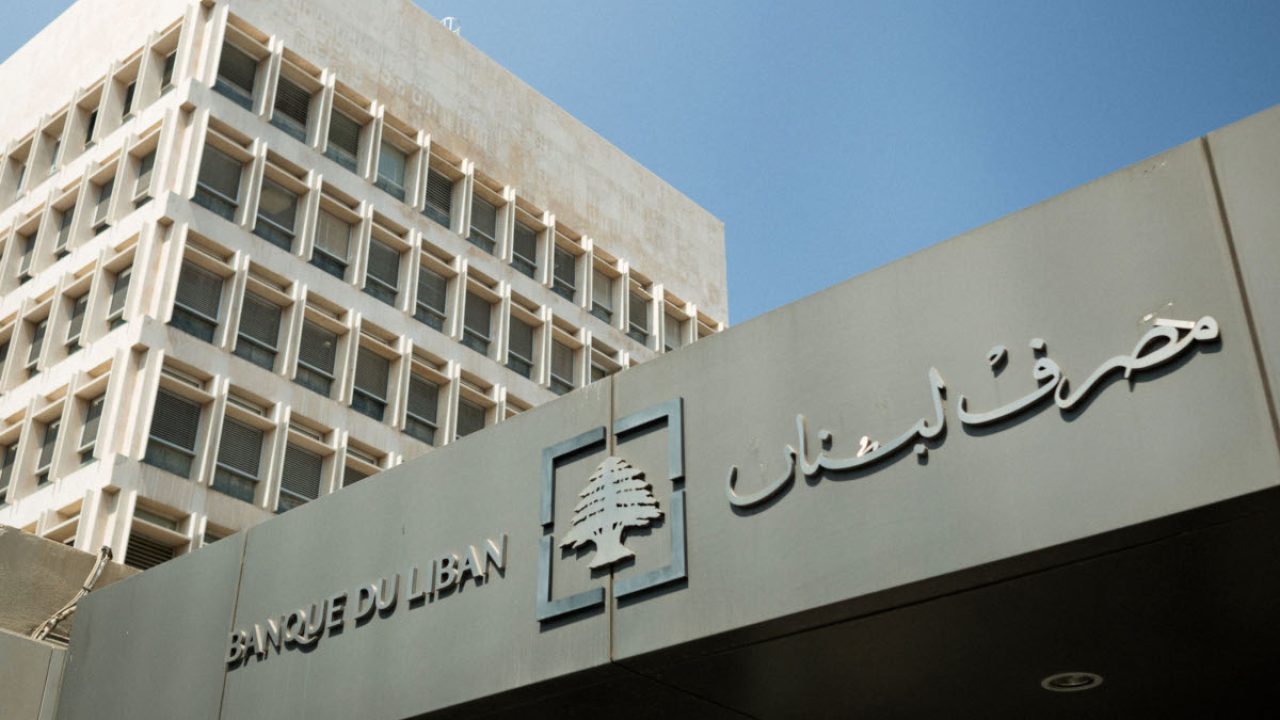 A logo sits above the entrance to the headquarters of Lebanon's central bank, also known as Banque du Liban, in Beirut, Lebanon, on Thursday, Sept. 12, 2019. With one of the worlds biggest debt burdens, the government has pledged measures to reduce its deficit and implement reforms, including fixing the ailing electricity sector. Photographer: Patrick Mouzawak/Bloomberg