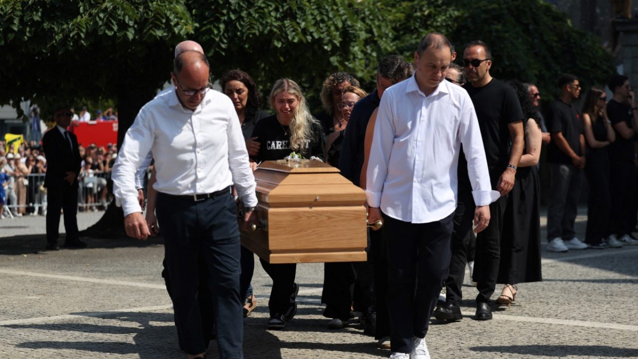 Relatives follow the coffin of Portuguese football player Andre Silva carried out of the church after the funeral ceremony for Liverpool's Portuguese forward Diogo Jota and his brother Andre Silva at the Mother Church of Gondomar, on the outskirts of Porto, on July 5, 2025. Liverpool forward Diogo Jota and his brother died in a car crash in Spain on July 3, 2025, sparking widespread grief just after the Portugal star had got married. (Photo by FILIPE AMORIM / AFP)