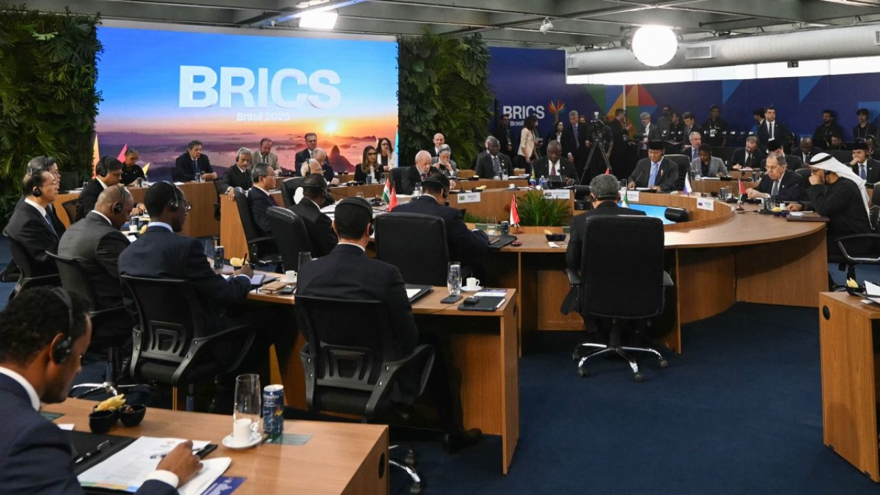 Brazil's President Luiz Inacio Lula da Silva (C) speaks during the first plenary session of the BRICS summit in Rio de Janeiro, Brazil, on July 6, 2025. BRICS leaders meeting in Rio de Janeiro on Sunday are expected to decry US President Donald Trump's "indiscriminate" trade tariffs, saying they are illegal and risk hurting the global economy. (Photo by Mauro PIMENTEL / AFP)