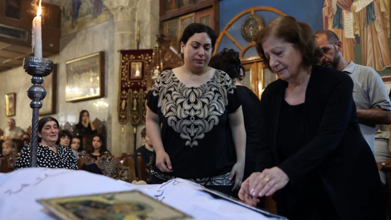 Christian Palestinians mourn Saad Salameh and Foumia Ayyad, killed earlier in an Israeli strike that hit the Holy Family Church in Gaza City, during their funeral ceremony at the Saint Porphyrius Church on July 17, 2025. An Israeli strike on Gaza's only Catholic church killed three people on July 17, the Latin Patriarchate of Jerusalem said, as Israel said it "never targets" religious sites and regretted any harm to civilians. (Photo by Omar AL-QATTAA / AFP)