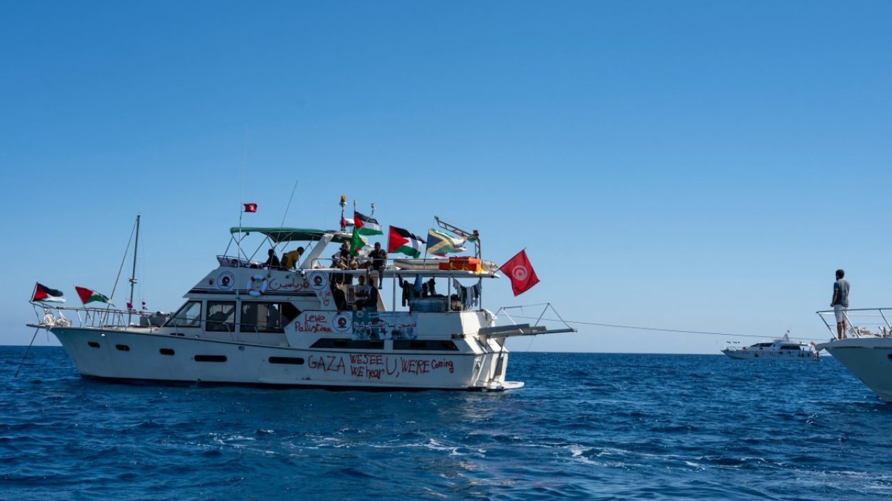 Members of the group of ships of the Global Sumud Flotilla to Gaza are seen moored at the small island of Koufonisi, south of the island of Crete, on September 26, 2025. After a reported attack by drones early on September 25, 2025 morning, Athens has said it will guarantee safe sailing in its waters. The Global Sumud Flotilla, carrying activists including Swedish environmentalist Greta Thunberg, blamed Israel for more than a dozen explosions heard around its vessels off Greece late on September 24, 2025. (Photo by Eleftherios ELIS / AFP)