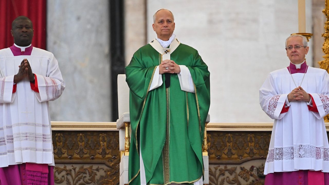 Pope Leo XIV (C) looks on as he attends the Jubilee Mass for the Missionary World and Migrants at St Peter's Square in The Vatican on October 5, 2025. (Photo by Andreas SOLARO / AFP)