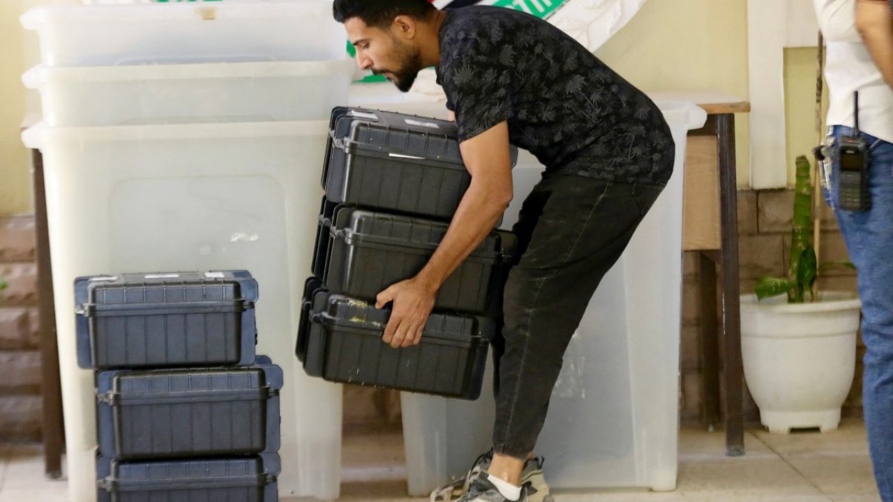 An employee of the Independent High Electoral Commission prepares ballot boxes and other equipment for polling stations as part of the process of setting up centers in preparation for voting on November 9 and the general voting on November 11, in the city center of Hilla, Babil Governorate, central Iraq on November 7, 2025. Iraq will hold parliamentary elections on November 11. At least 25 percent of parliamentary seats must go to women, according to the quota system that also reserves nine seats for minorities. More than 7,700 candidates, nearly a third of whom are women, are running for election in the country of around 46 million people. (Photo by Karar Jabbar / AFP)