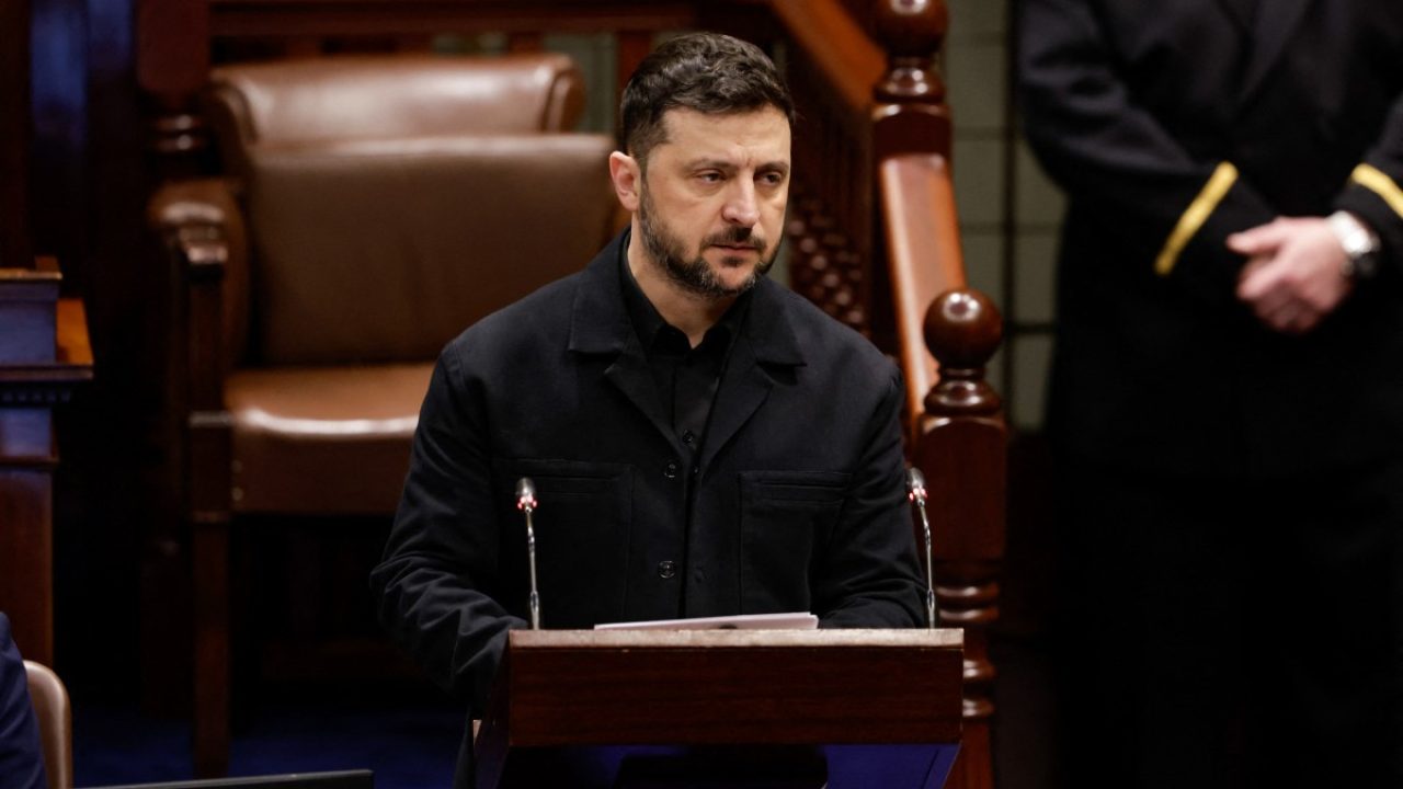 Ukraine's President Volodymyr Zelensky in the Dáil Chamber delivering a special speech in a joint sitting of the two Houses of Parliament in Leinster House Dublin, during his visit to the Irish capital on December 2, 2025. (Photo by MAXWELLS / POOL / AFP)