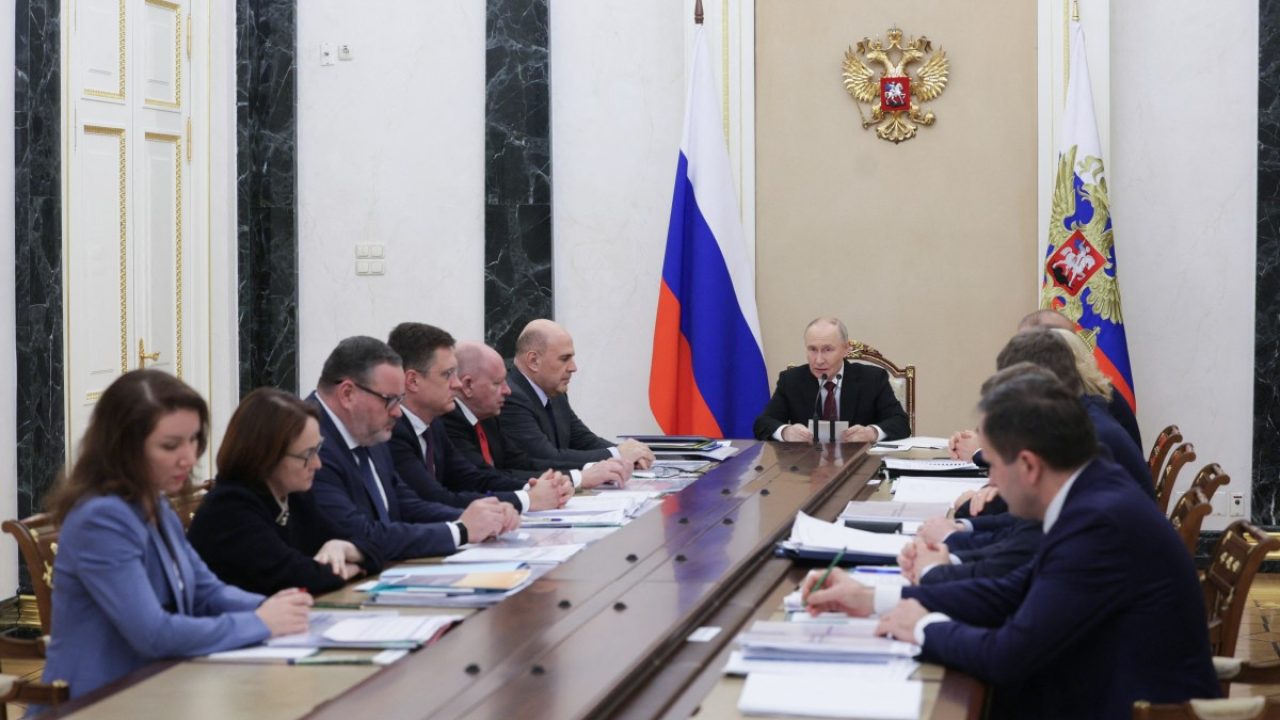 In this pool photograph distributed by the Russian state agency Sputnik, Russia's President Vladimir Putin chairs a meeting on economic issues in Moscow on December 11, 2025. (Photo by Gavriil Grigorov / POOL / AFP)