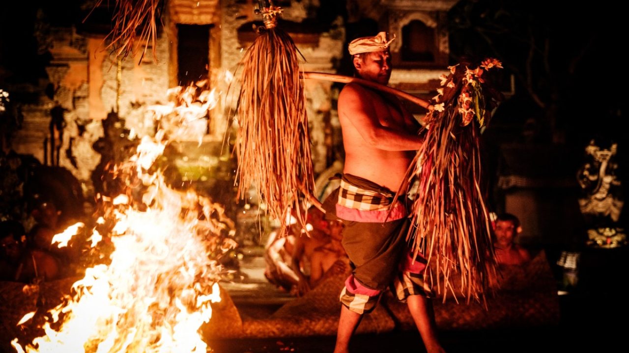A Taman Kaja community member puts up a performance on New Year's Eve at the Pura Dalem Taman Kaja temple in Bali on December 31, 2025. (Photo by Yasuyoshi CHIBA / AFP)