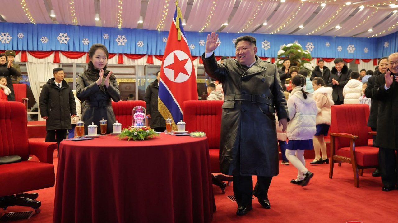 This picture taken on December 31, 2025 and released by North Korea's official Korean Central News Agency (KCNA) via KNS on January 1, 2026 shows North Korean leader Kim Jong Un waving alongside his daughter Kim Ju Ae (L) during a New Year's concert at the May Day Stadium in Pyongyang. North Korean leader Kim Jong Un has praised his troops fighting abroad as forging an "invincible alliance" with Russia in a new year's message, state media said on January 1. (Photo by KCNA VIA KNS / AFP) / South Korea OUT / SOUTH KOREA OUT / ---EDITORS NOTE--- RESTRICTED TO EDITORIAL USE - MANDATORY CREDIT "AFP PHOTO/KCNA VIA KNS" - NO MARKETING NO ADVERTISING CAMPAIGNS - DISTRIBUTED AS A SERVICE TO CLIENTS
THIS PICTURE WAS MADE AVAILABLE BY A THIRD PARTY. AFP CAN NOT INDEPENDENTLY VERIFY THE AUTHENTICITY, LOCATION, DATE AND CONTENT OF THIS IMAGE. /