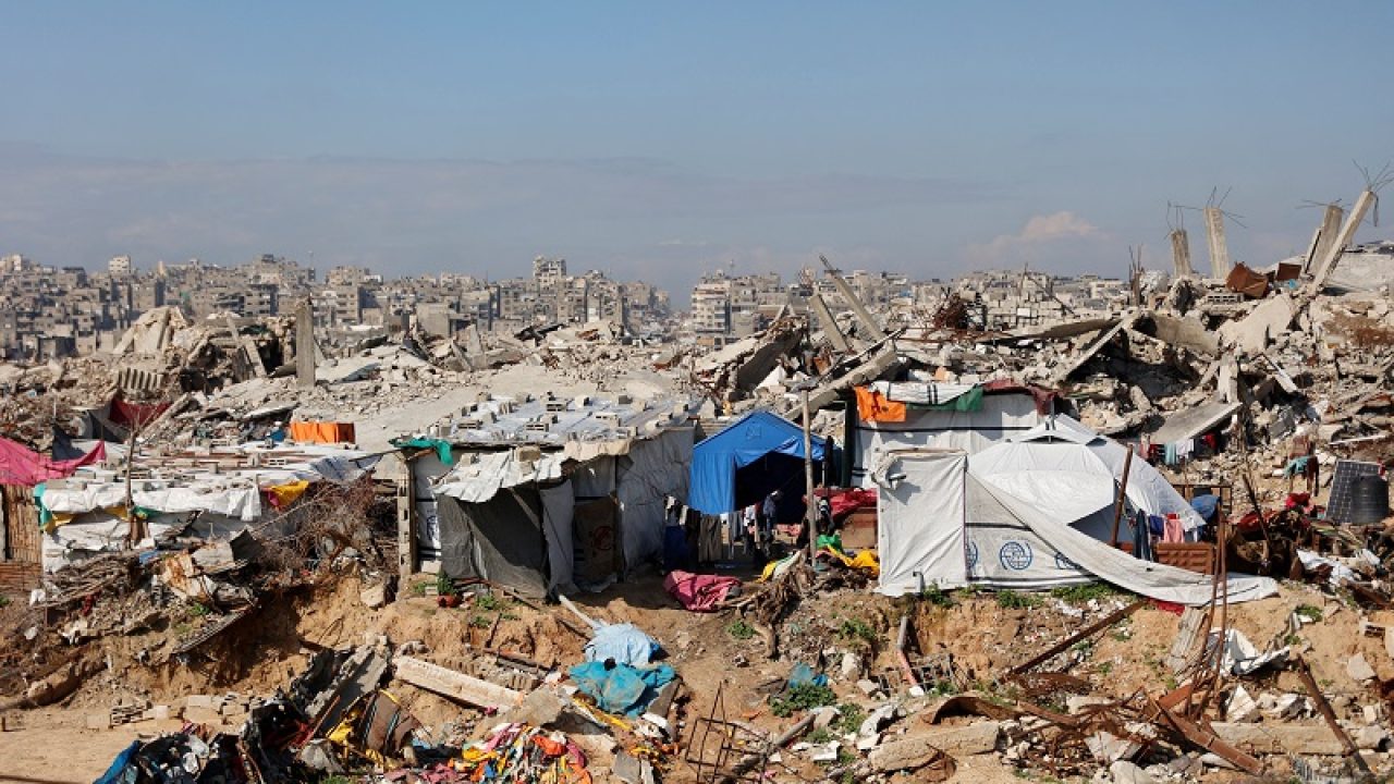 Displaced Palestinians live amongst the rubble and debris of homes and businesses destroyed by the Israeli military in over two years of military strikes on the Gaza Strip enclave, in Jabalia refugee camp, in the northern Gaza Strip on January 17, 2026. US President Donald Trump's so-called "Board of Peace" for postwar Gaza began to take shape on January 17, with the leaders of Egypt, Turkey, Argentina and Canada asked to join. (Photo by Omar AL-QATTAA / AFP)