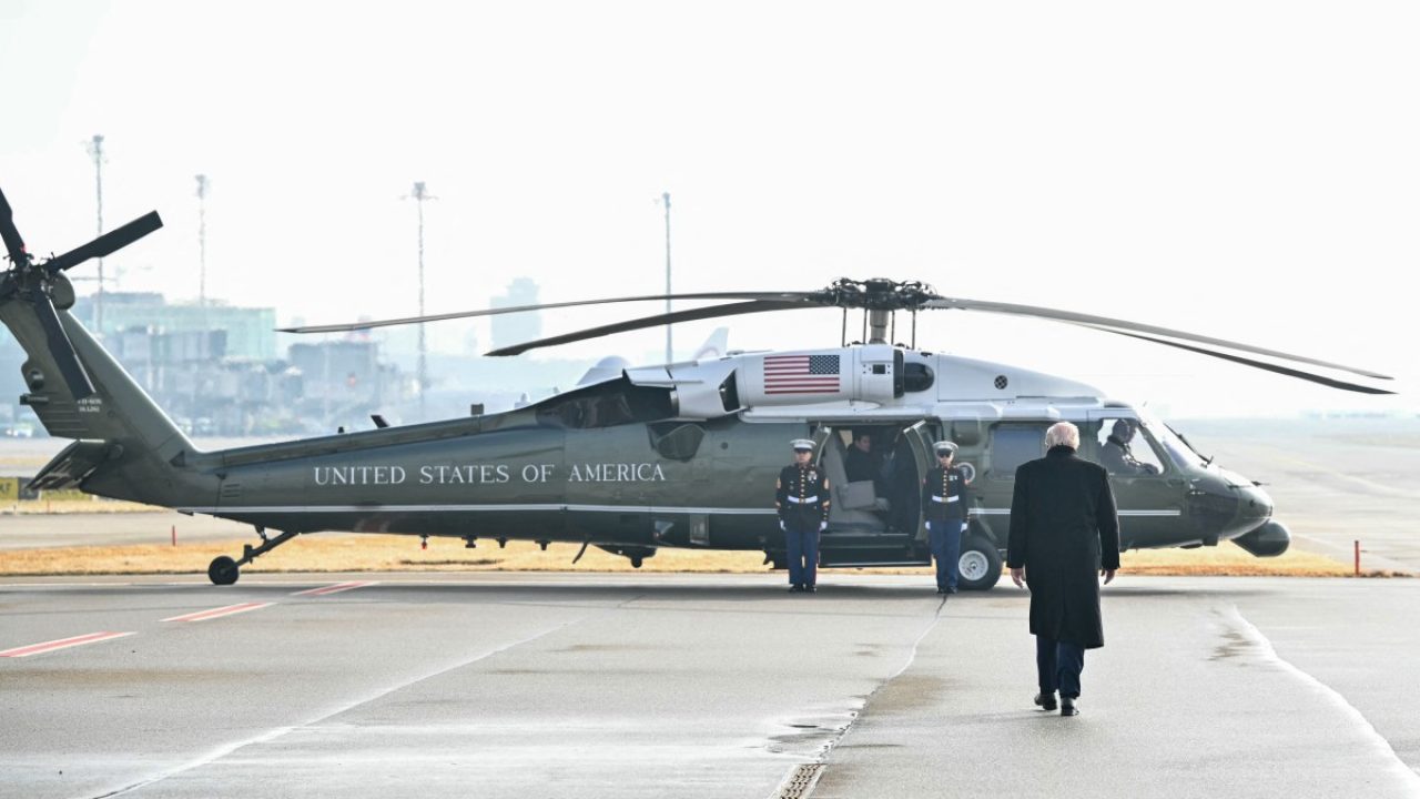 US President Donald Trump walks on the tarmac upon arrival at Zurich Airport to board the Marine One helicopter en route Davos where he will attend the World Economic Forum on January 21, 2026. The World Economic Forum takes place in Davos from January 19 to January 23, 2026. (Photo by Mandel NGAN / AFP)
