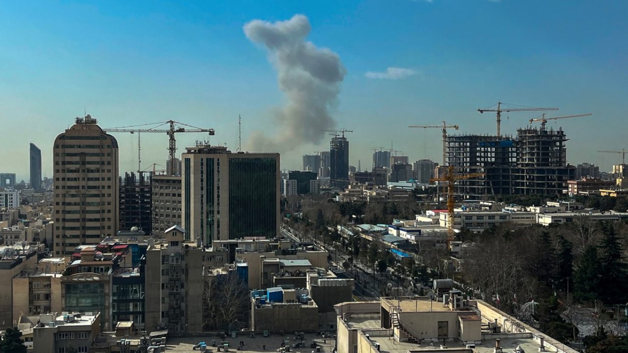 A plume of smoke rises following a reported explosion in Tehran on February 28, 2026. Israel's defence ministry announced February 28 it had launched a "preemptive strike" on Iran as sirens sounded in Jerusalem and people across the country received phone alerts about an "extremely serious" threat. (Photo by AFP)