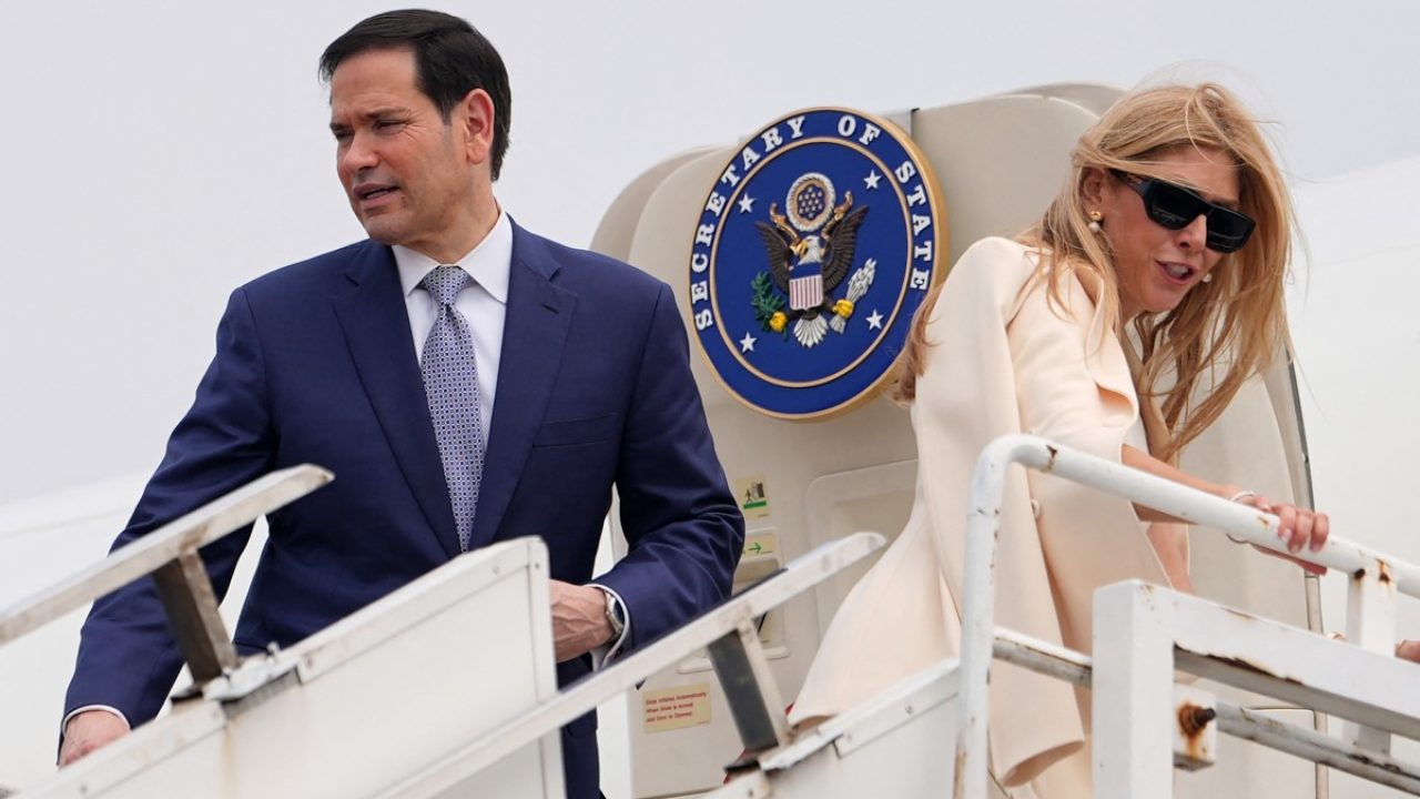 US Secretary of State Marco Rubio and his wife Jeanette board their plane for New Delhi at Netaji Subhash Chandra Bose International Airport in Kolkata on May 23, 2026. Rubio arrived May 23 on his first trip to India where he will meet Prime Minister Narendra Modi on the heels of US diplomacy with China. (Photo by Julia Demaree Nikhinson / POOL / AFP)