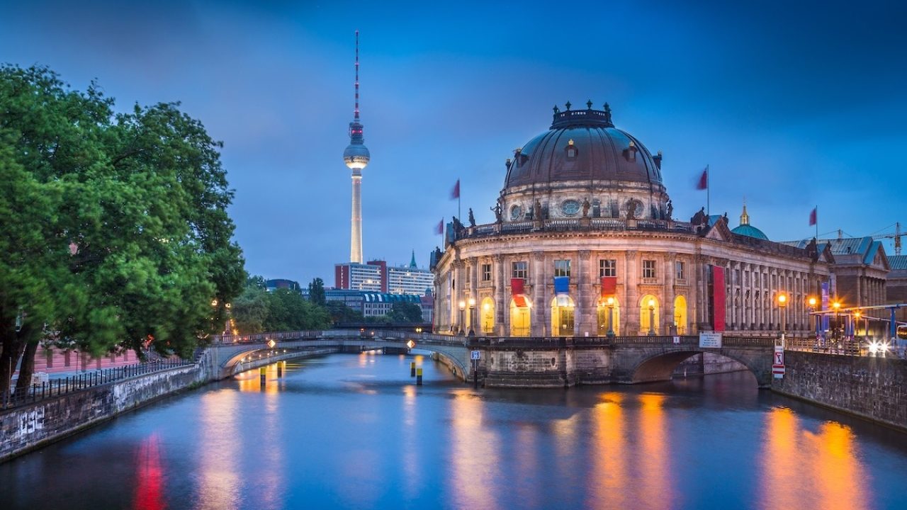 Beautiful view of Museumsinsel (Museum Island) with famous TV tower and Spree river in twilight during blue hour at dusk, Berlin, Germany