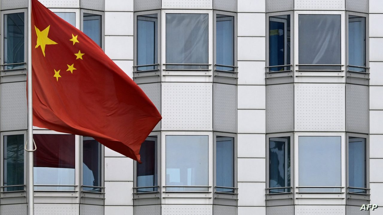 The Chinese flag is pictured in front of the building of the Chinese embassy in Berlin on April 22, 2024. Investigators on April 22, 2024 arrested three German nationals in western Germany on suspicion of spying for China, prosecutors said, accusing them of gathering information on technology that could be used for military purposes. (Photo by JOHN MACDOUGALL / AFP)