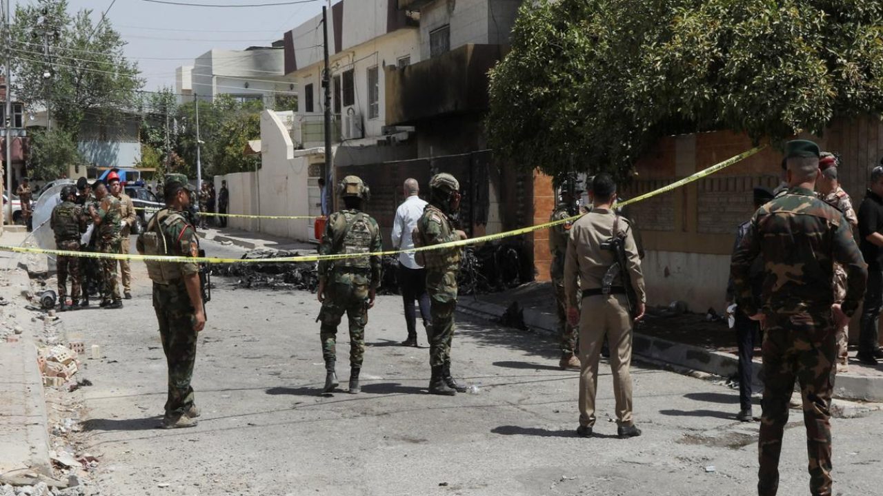 Members of Iraqi security forces stand near the debris of an armed drone shot down by Iraq's air defences in Kirkuk, Iraq, August 29, 2024. REUTERS/Ako Rasheed