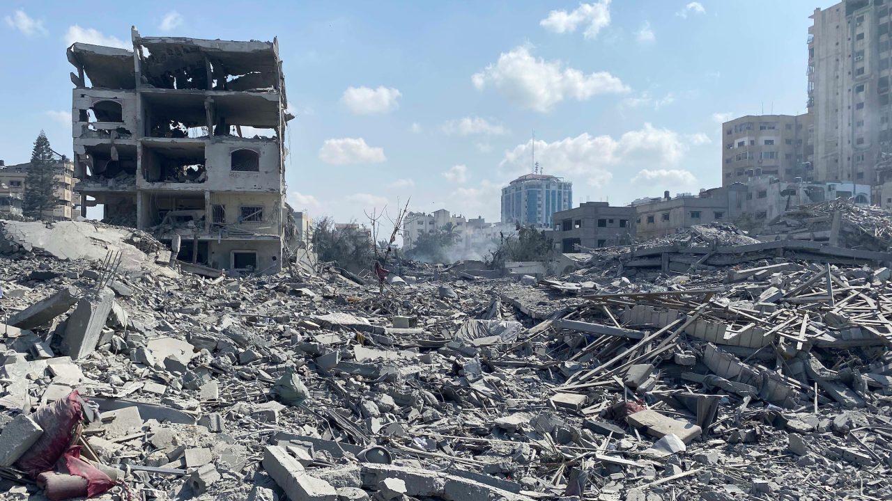 Palestinians inspect the damage following an Israeli airstrike on the El-Remal aera in Gaza City on October 9, 2023. Israel continued to battle Hamas fighters on October 10 and massed tens of thousands of troops and heavy armour around the Gaza Strip after vowing a massive blow over the Palestinian militants' surprise attack. Photo by Naaman Omar apaimages