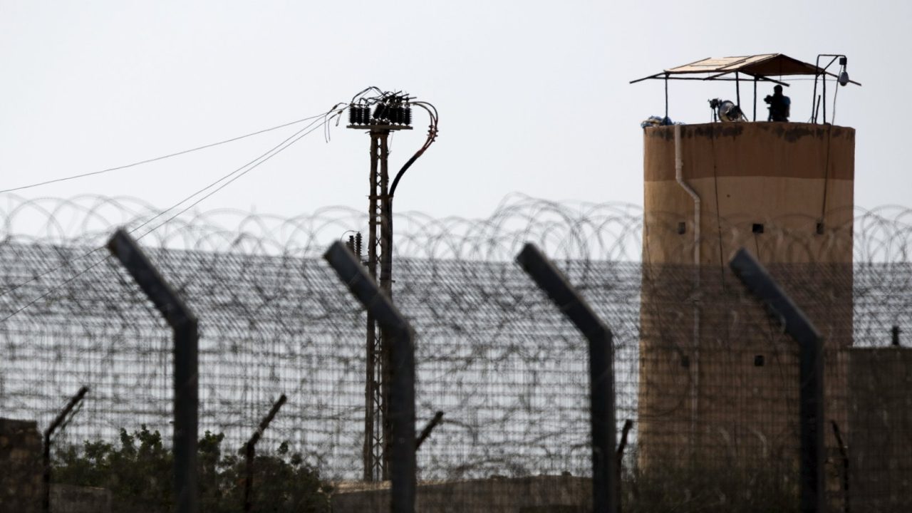 A member of Egypt's security forces stands on a watchtower in North Sinai as seen from across the border in southern Israel July 1, 2015. Islamic State militants launched a wide-scale coordinated assault on several military checkpoints in North Sinai on Wednesday in which 50 people were killed, security sources said, the largest attack yet in the insurgency-hit province. Egyptian army F-16 jets and Apache helicopters strafed the region that lies within the Sinai Peninsula, a strategic area located between Israel, the Gaza Strip and the Suez Canal. REUTERS/Amir Cohen
