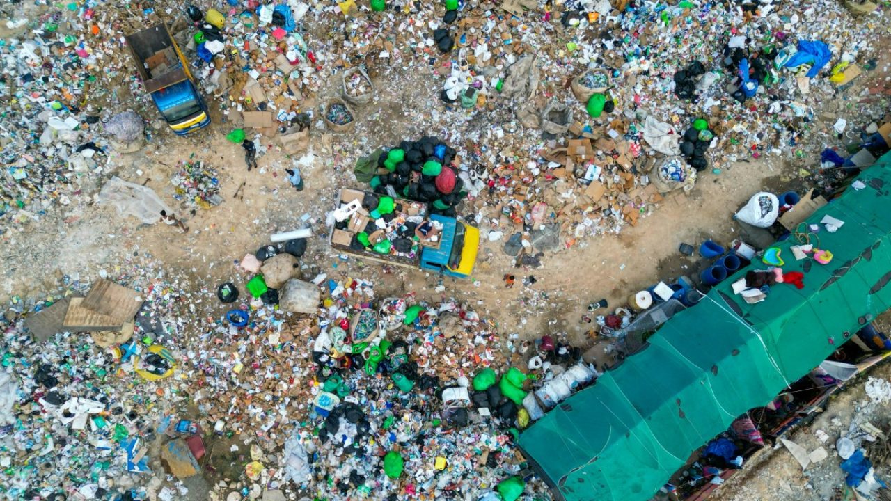 (FILES) An aerial view shows plastic waste at a landfill on the outskirts of Bengaluru on November 23, 2024. According to a recent OECD report on plastic in Southeast Asia, more ambitious public policies could reduce waste by more than 95% by 2050 in these countries, where plastic consumption has increased ninefold since 1990 to 152 million tonnes in 2022.
But for environmental activists, the task is daunting in the face of this ocean of plastic. (Photo by Idrees MOHAMMED / AFP)