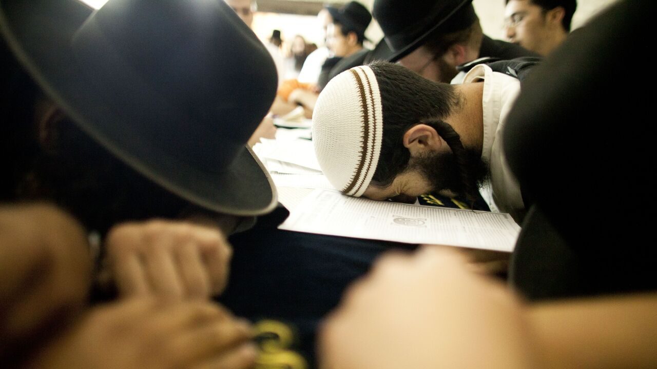 NABLUS, WEST BANK - JULY 04: (ISRAEL OUT)  Jewish worshippers prays at Joseph's Tomb as hundreds of faithful mark the anniversary of the biblical Joseph's death, on July 4, 2011 in Nablus, West Bank. The IDF has ordered a limit to the number of people allowed into Nablus. However, Hilltop Youth have vowed to march on Tomb regardless of the order. (Photo by Uriel Sinai/Getty Images)