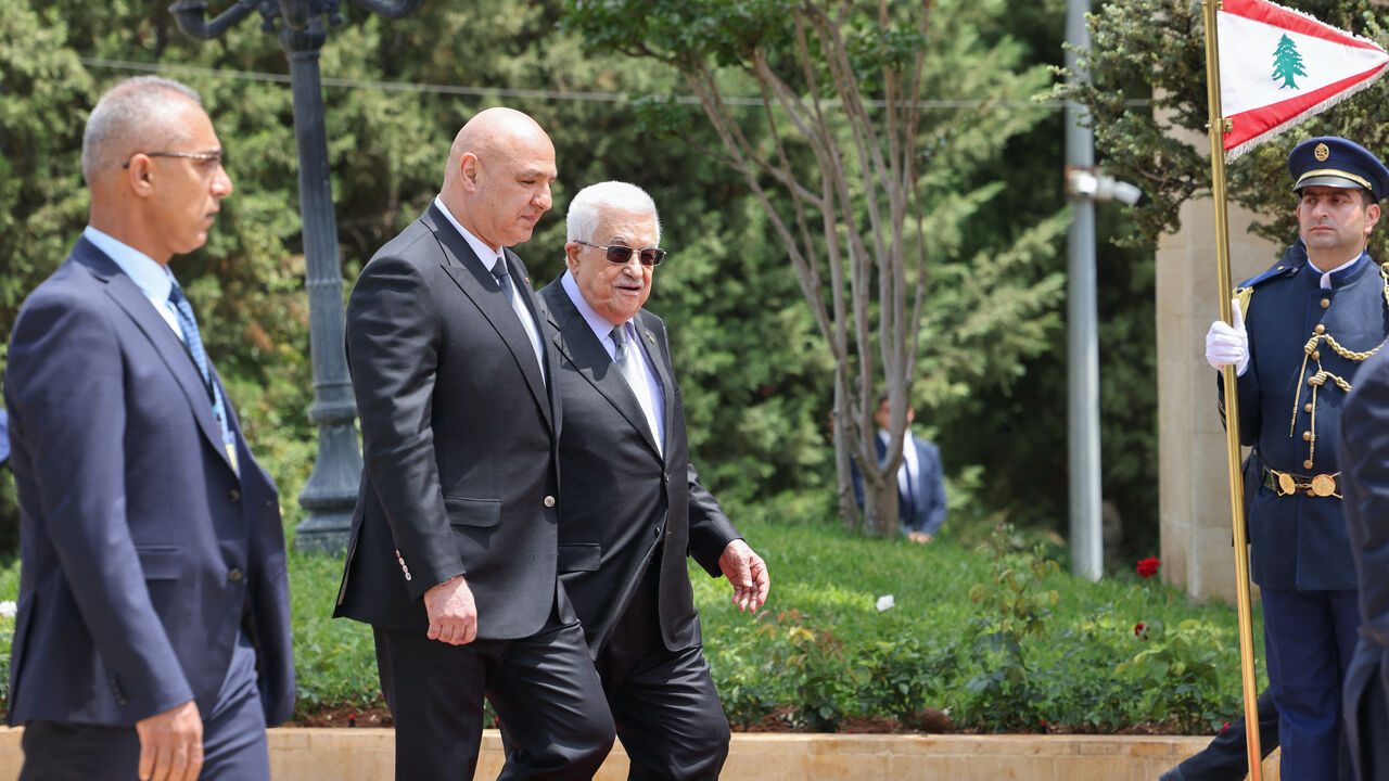 Lebanese President Joseph Aoun (2nd L) walks alongside Palestinian Authority President Mahmud Abbas as they review an honour guard at the Presidential Palace in Baabda, on May 21, 2025. Abbas arrived in Beirut, where he is set to discuss the disarmament of Palestinian refugee camps as Lebanon seeks to impose its authority on all its territory. (Photo by ANWAR AMRO / AFP)