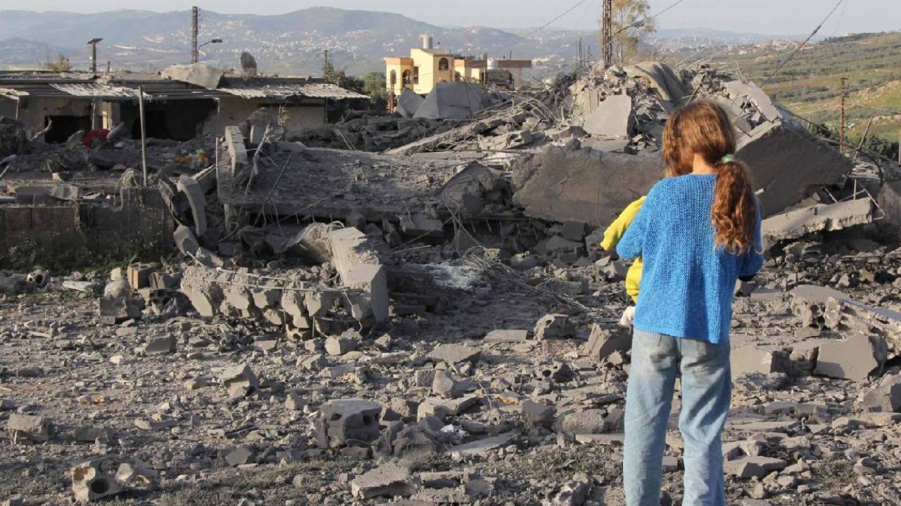Girl looking at destroyed house