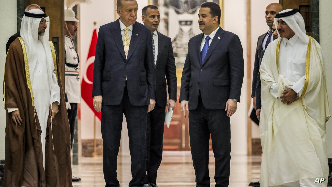 Iraq's Prime Minister Mohammed Shia al-Sudani, second right, receives Turkey's President Recep Tayyip Erdogan, second left, Qatar's Minister of Transport Jassim bin Saif bin Ahmed al-Sulaiti, right, and UAE's Minister of Energy Suhail Mohamed al-Mazrouei, left, ahead of their meeting in Baghdad, Iraq, Monday April 22, 2024. (Ahmad Al-Rubaye/Pool via AP)