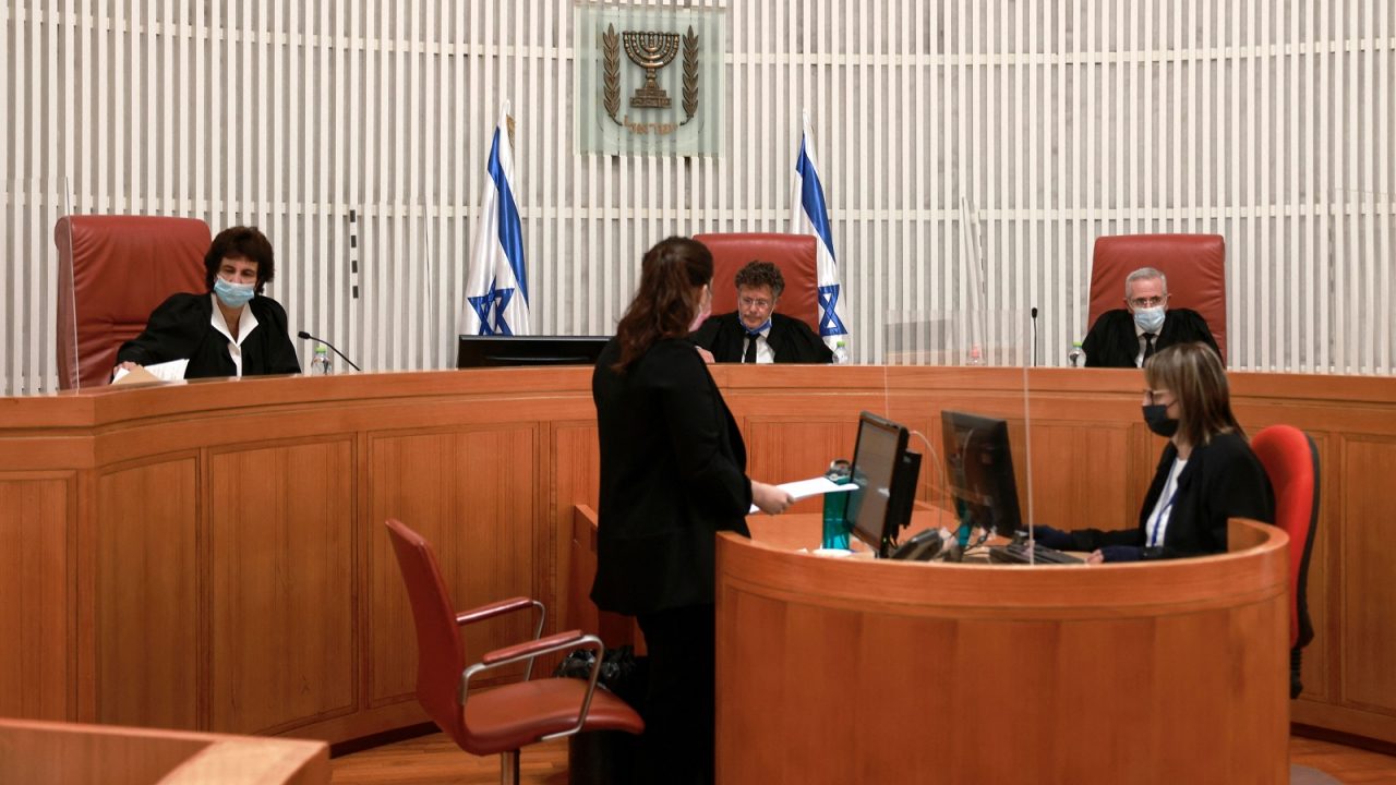 Judges take their seats at the Israel Supreme Court in Jerusalem on October 25, 2021, before a hearing expected to decide on the flashpoint case of evictions from the predominantly Arab neighbourhood of Silwan in east Jerusalem. (Photo by MENAHEM KAHANA / AFP) (Photo by MENAHEM KAHANA/AFP via Getty Images)